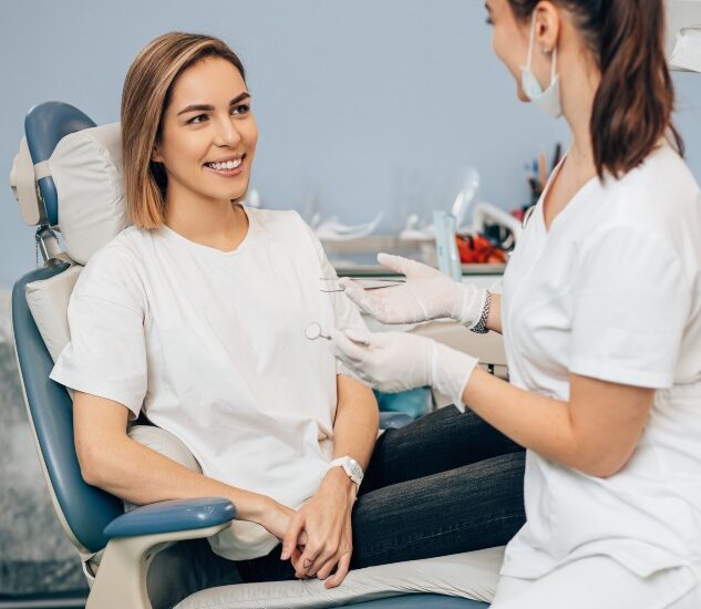 A smiling patient & a dentist in a clinic, emphasizing regular dental care in South Bend, IN