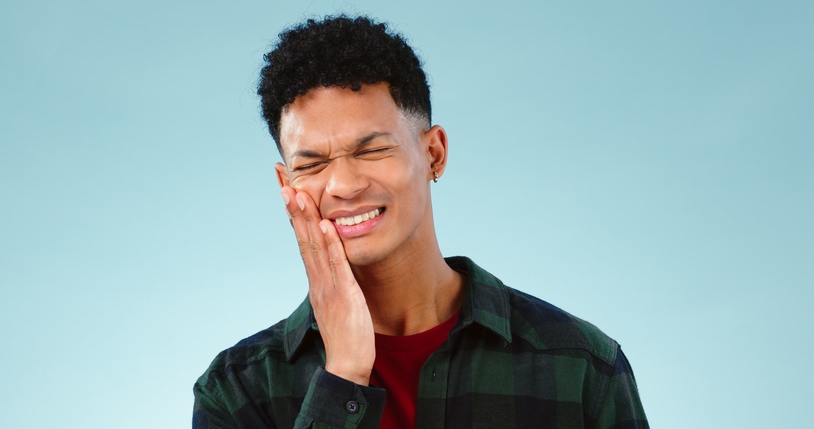 A person with severe tooth pain represents the need for emergency dental care in South Bend, IN