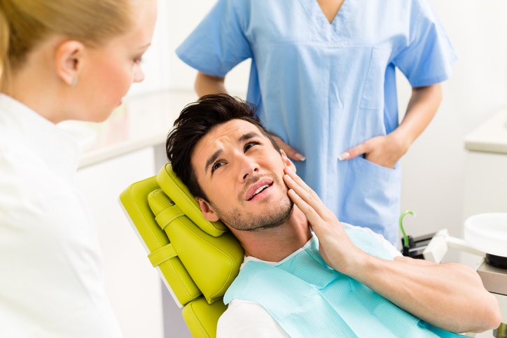 Dental emergency visit with patient experiencing severe tooth pain in South Bend, IN
