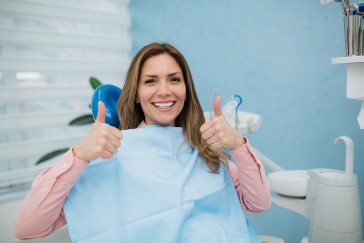 A women showing bright smile after teeth whitening at dental clinic in South Bend, IN